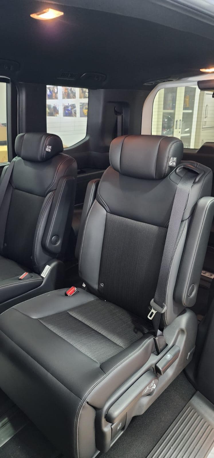 Leather captain seats inside Mesa Travels 7-seater MPV airport transfer vehicle